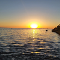 Pine Island Sunset Canvas Print — Kayakers at Dusk