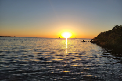 Pine Island Sunset Canvas Print — Kayakers at Dusk